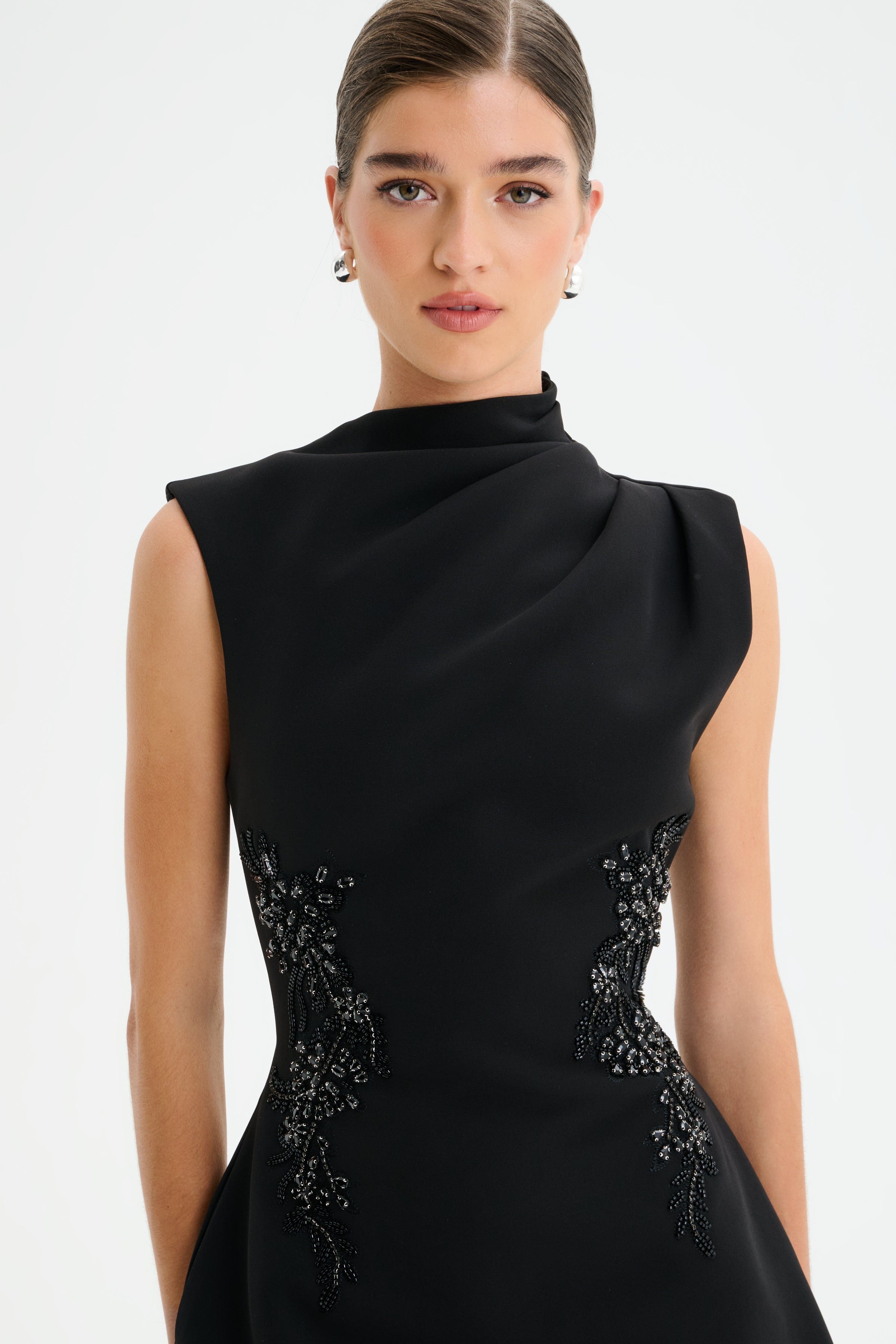 AMBAR Asymmetric High Neck Embellished Tulip Mini Dress in Black
